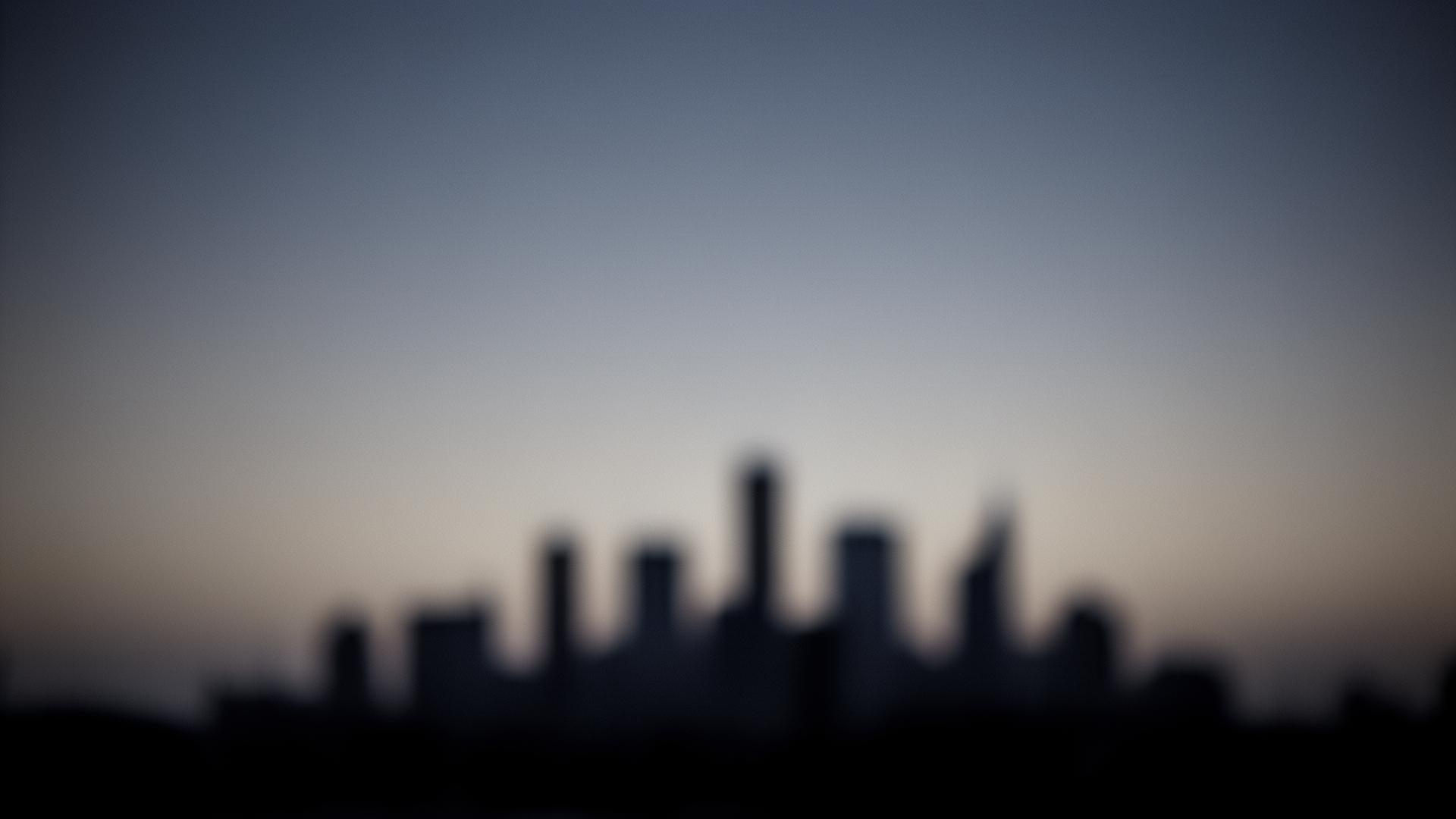 Soft blurred cityscape silhouette at dusk